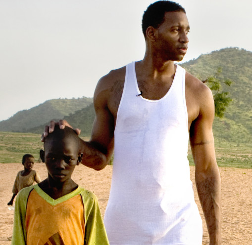 Tracy McGrady with young boy during his visit to Darfuri refugee camp in eastern Chad. Photo: Josh Rothstein