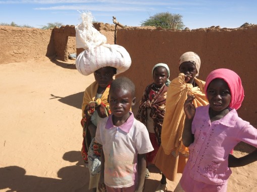 9. Community: right when a mother is telling me that she has no more food, a neighbor girl shows up with a bag of grain on her head for the family in need.